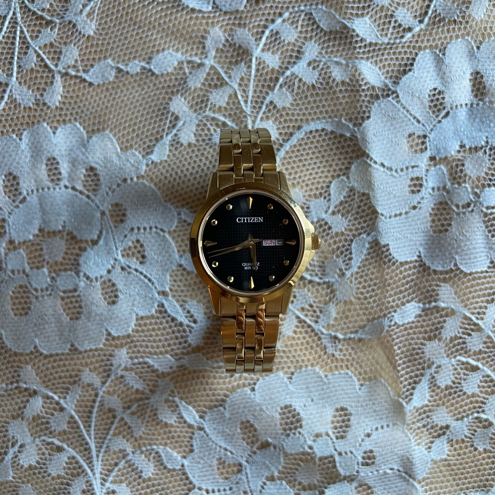 gold toned citizen stainless steel quartz watch